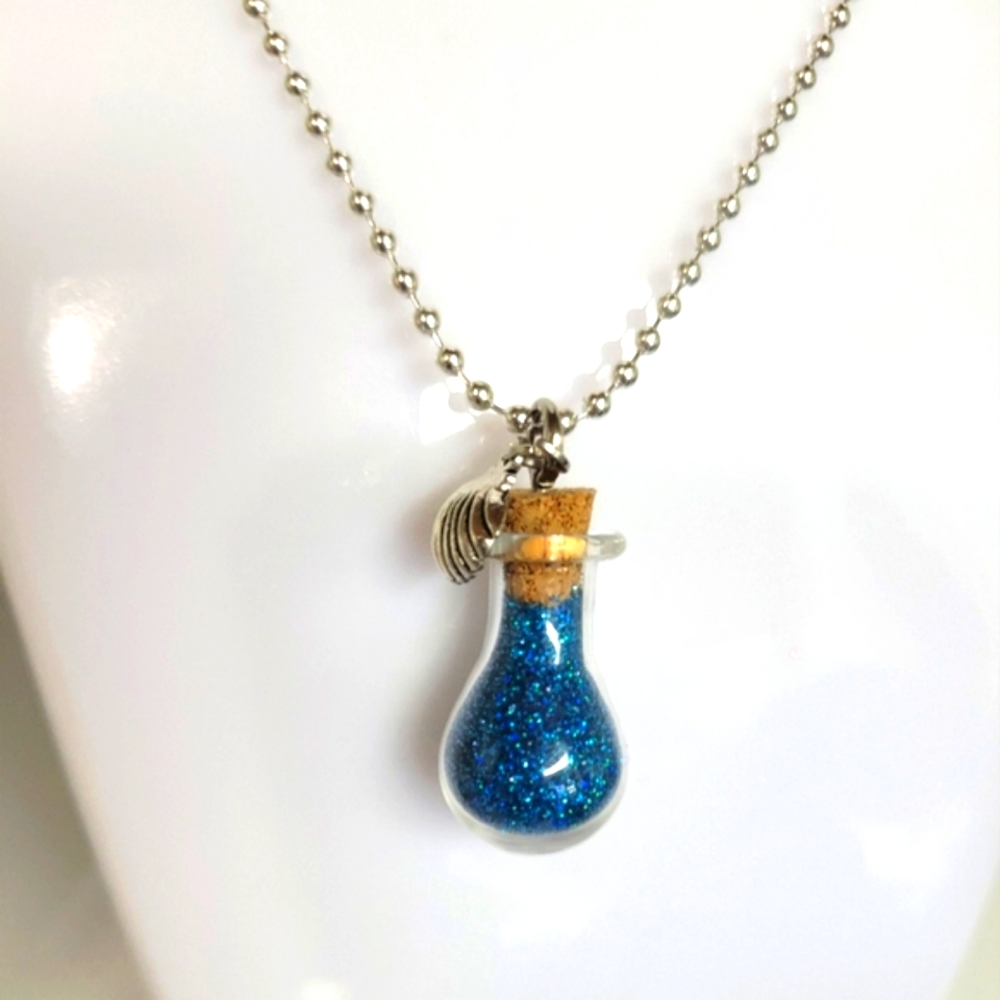 TEAL HOLOGRAPHIC glitter pixie fairy dust necklace with small shell charm.